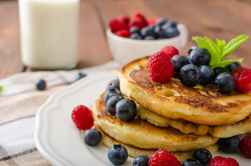 Pancakes with forest fruit and mint