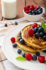 Pancakes with forest fruit and mint