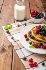 Pancakes with forest fruit and mint