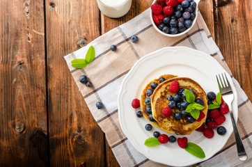 Pancakes with forest fruit and mint