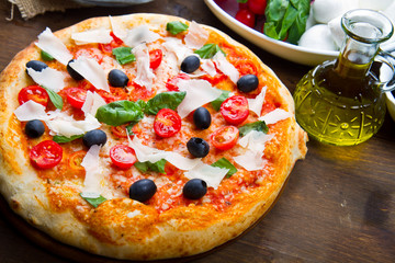 Delicious fresh pizza served on wooden table