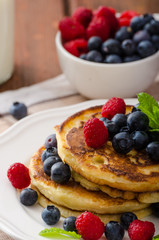 Pancakes with forest fruit and mint