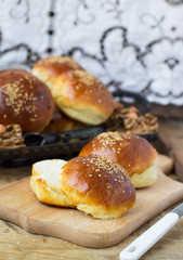 buns for burgers on wooden background