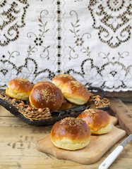 buns for burgers on wooden background