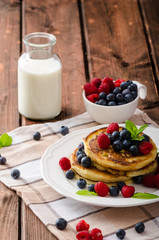 Pancakes with forest fruit and mint