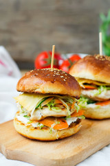burgers with chicken and stuffed  juicy with cucumber, carrots a