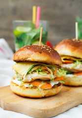 burgers with chicken and stuffed  juicy with cucumber, carrots a