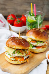 burgers with chicken and stuffed  juicy with cucumber, carrots a