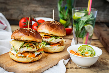 burgers with chicken and stuffed  juicy with cucumber, carrots a