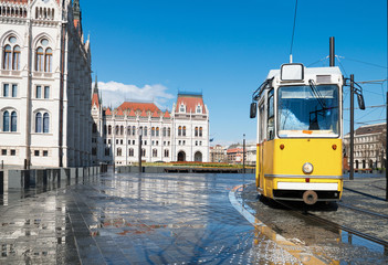 Historical tram passing by Parliament in Budapest, Hungary © tilialucida