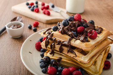 Homemade belgian waffles with fruit and chocolate