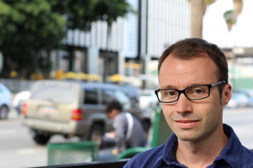 Trendy handsome man with eyeglasses in the street