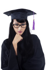 Graduate student wearing graduation cloak