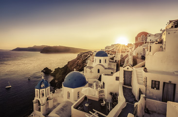 Sunset over blue dome churches of Santorini, Greece