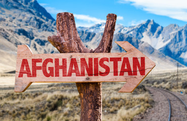 Afghanistan wooden sign with desert road background