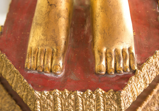 Golden sunshine and leg sculpture Buddha