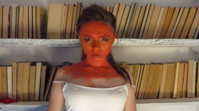 Evil woman with a red clock face shows delayed for man