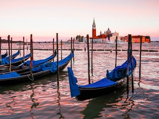 Gondolas in Venice lagoon at sunset, Venice, Italy