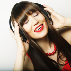 Young happy woman with headphones