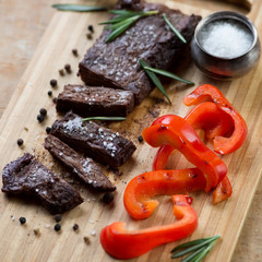 Well-done machete steak with grilled bell pepper and spices