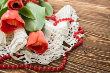red tulips on wooden background