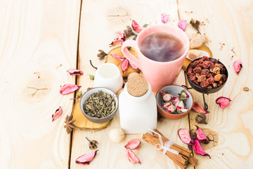 Tea cups with teapot on old wooden table