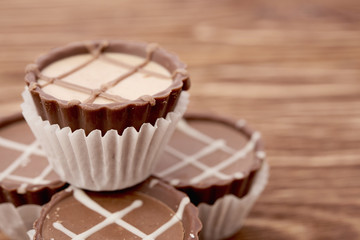 Dark chocolate on wooden background