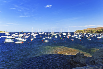 Boats in mediterranean town Cadaques harbor in summer