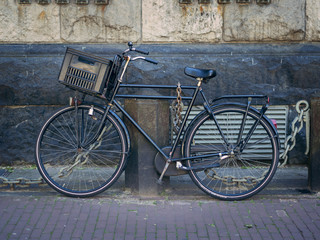 Fototapeta na wymiar Typical bicycle on Amsterdam street. Netherlands, Europe