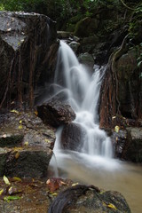 Naklejka na ściany i meble The small waterfall and rocks in forest, thailand