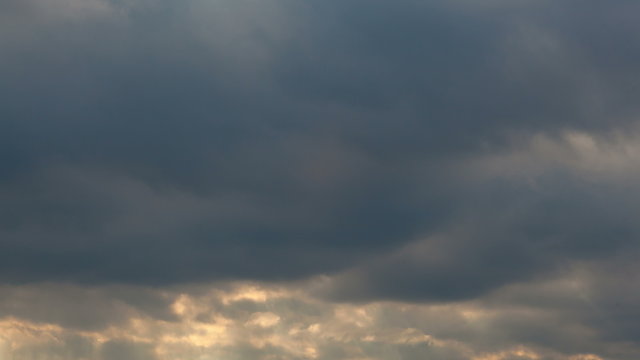 Time Lapse of Fast Dark Stormy Clouds with Beaming Sun Rays at Sunset 1920x1080