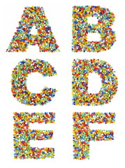 Letters of the alphabet A through F made from colorful glass bea