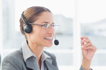 Businesswoman with headset in call centre 