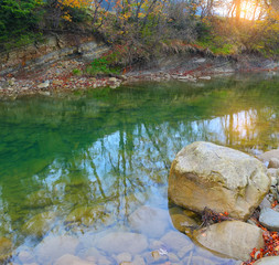 crystal clear mountain lake in autumn