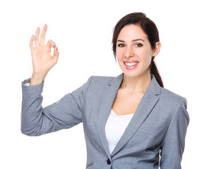 Businesswoman with ok sign gesture