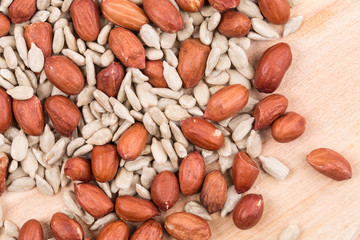 Close up of peanuts and sunflower seeds.