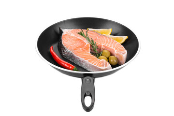 Salmon steak on frying pan.