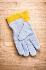obverse side of the protective glove on wooden board
