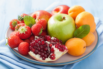 fresh fruits and berries. strawberry, apple, pomegranate