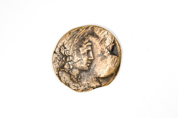 Fototapeta premium Vintage bronze coin with portrait on a white background