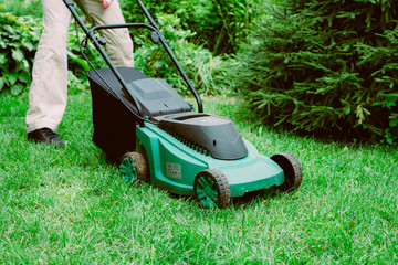 man with lawn mower