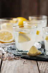Homemade lemonade with lemon and ice