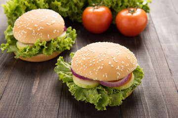 vegetable hamburger with french fries on the wooden background.
