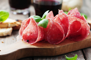 Delicious salami with basil and wine - obrazy, fototapety, plakaty