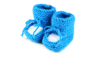 Handmade baby booties isolated on a white