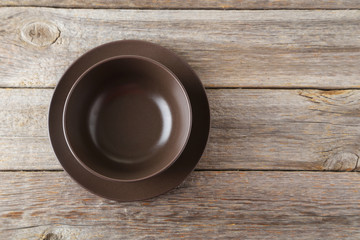 Empty bowl on grey wooden background