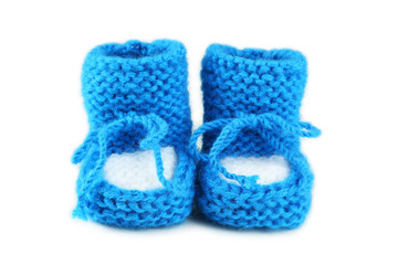 Handmade baby booties isolated on a white