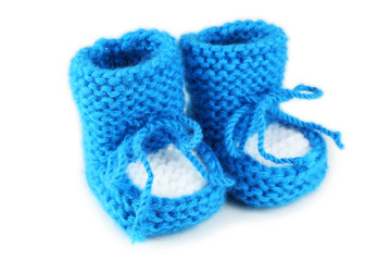 Handmade baby booties isolated on a white