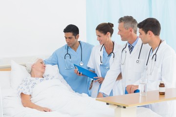 Doctor explaining report to female patient