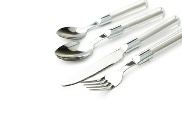 Fork, spoon and knife on white background